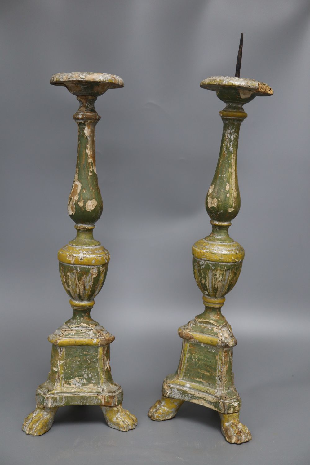 A pair of Italian painted pine pricket candlesticks, height 52cm